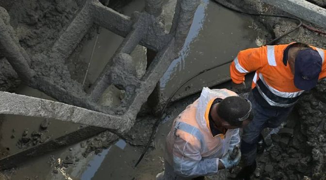 Overhead view of construction workers at a construction site,